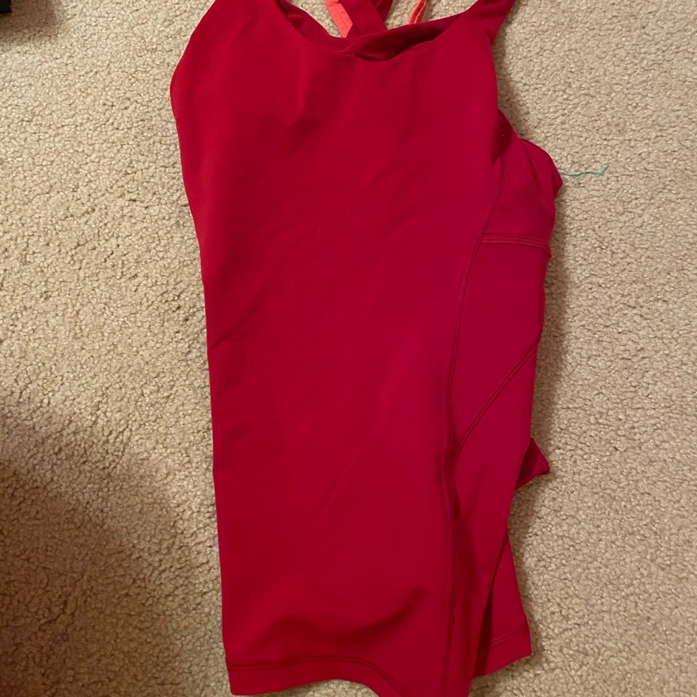 Tank top with Criss cross detail in back.